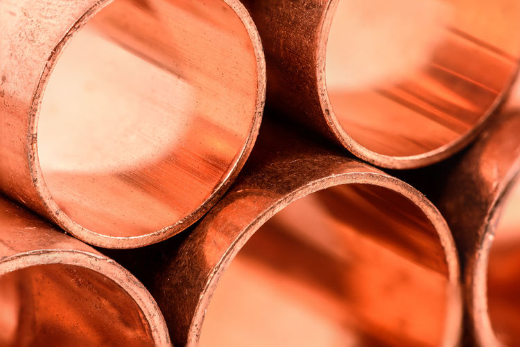 Copper round pipes, industrial background