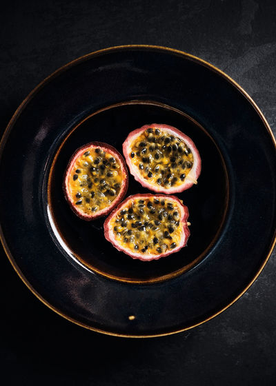 High angle view of passion fruit in bowl on table