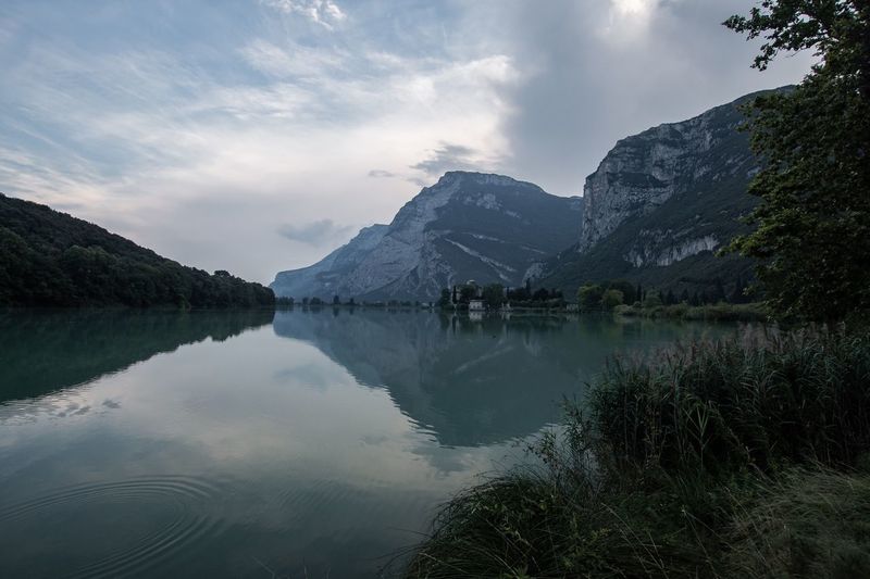 Scenic view of lake and mountains against sky