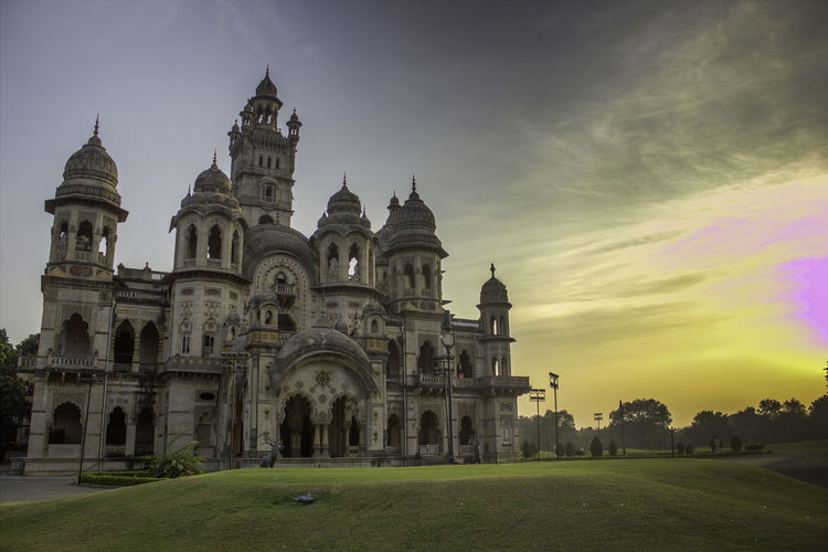 View of laxmi villas palace against a dramatic sunset in vadodara the state of gujarat in india