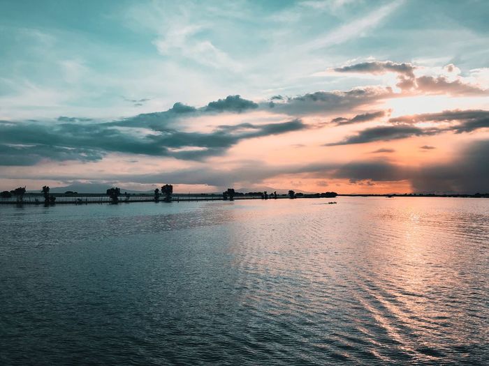 Scenic view of sea against sky at sunset