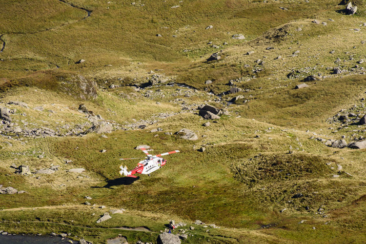 High angle view of rescue helicopter landing at snowdonia national park