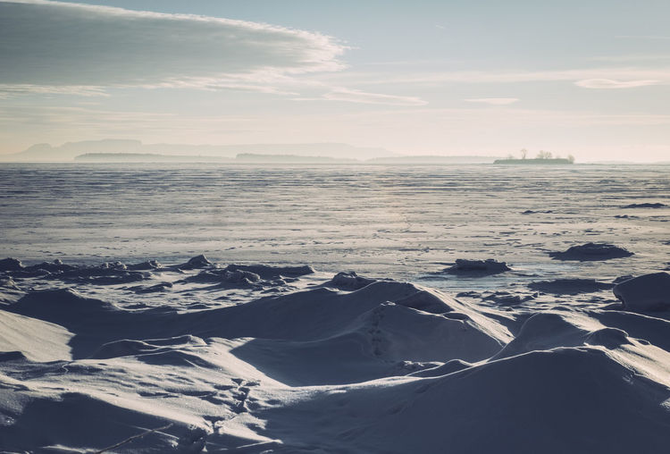 Aerial view of landscape against sky during winter