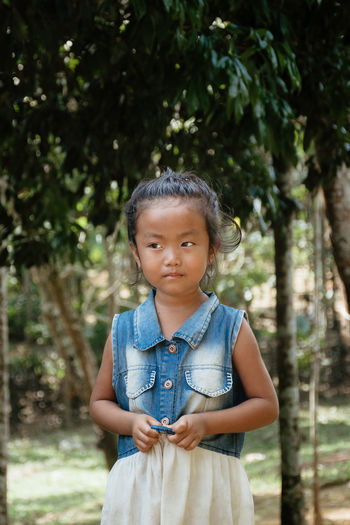 A young girl poses for a potrait in rangsapara, goalpara 