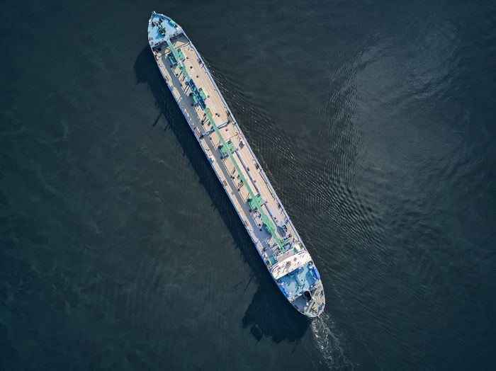 Aerial view of oil tanker moving on volga river