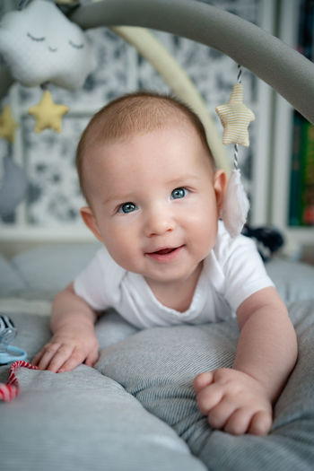 Portrait of cute baby girl at home