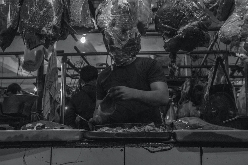 Low angle view of butcher working in shop