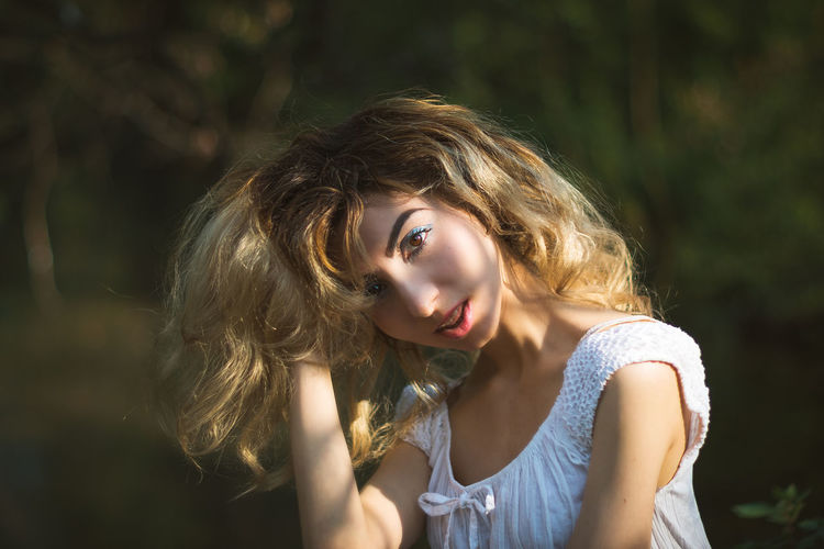 Portrait of young woman with blond hair