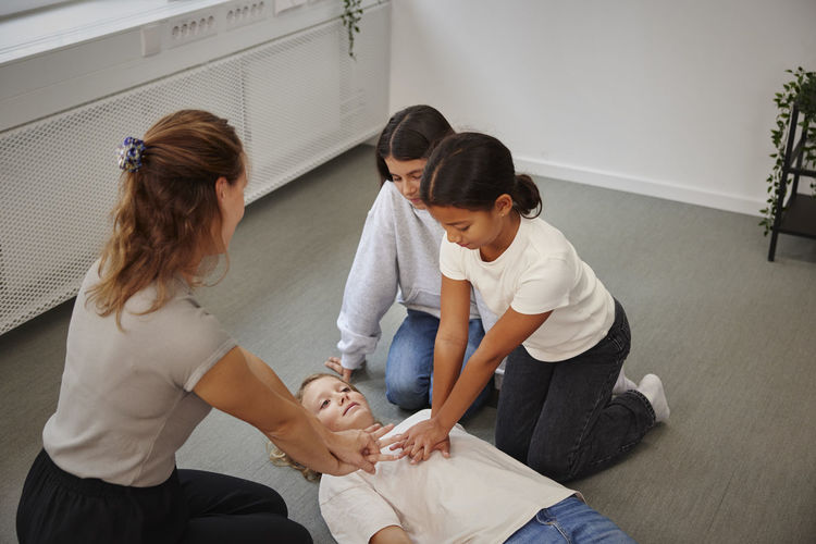 Teacher giving first aid training