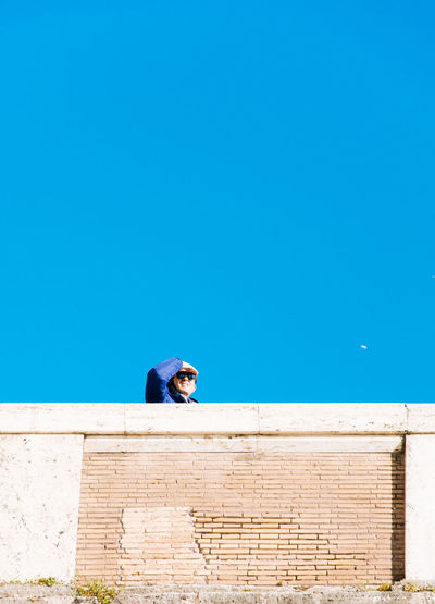 Low angle view of building against clear blue sky