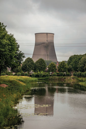 Canal and nuclear power plant near geertruidenberg. a small village in the netherlands countryside.