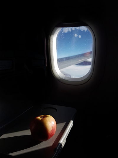 Close-up of airplane seen through window