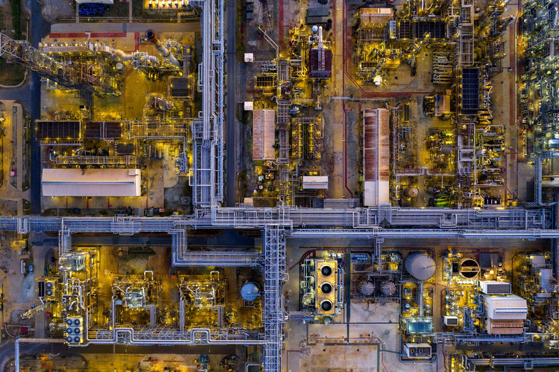 Aerial view of illuminated factory in city