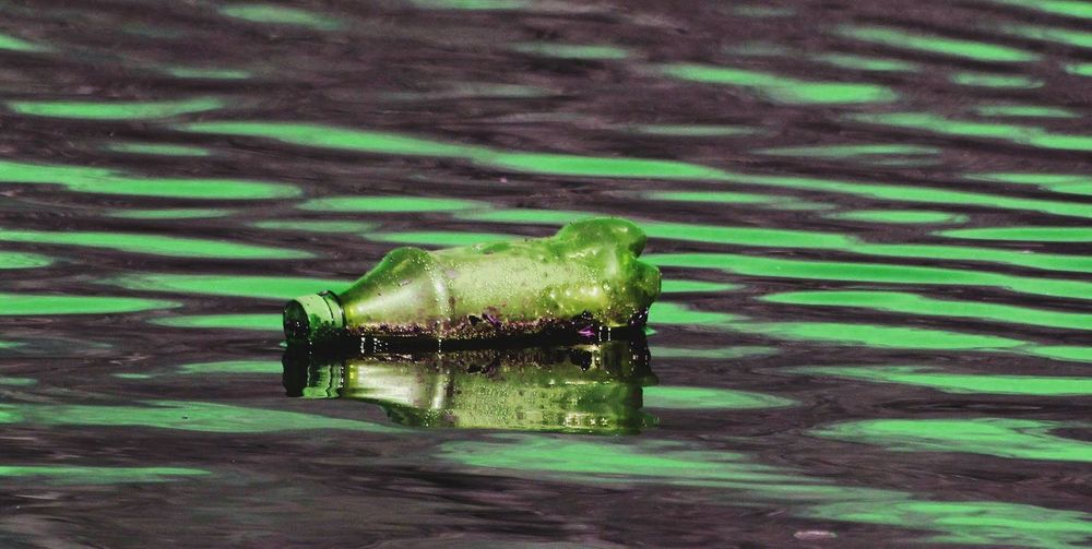 Abandoned plastic bottle on river
