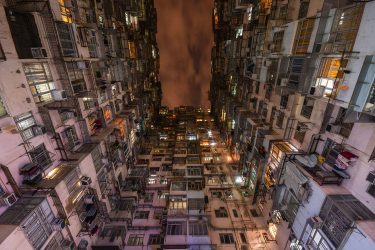 High angle view of illuminated buildings in city at night