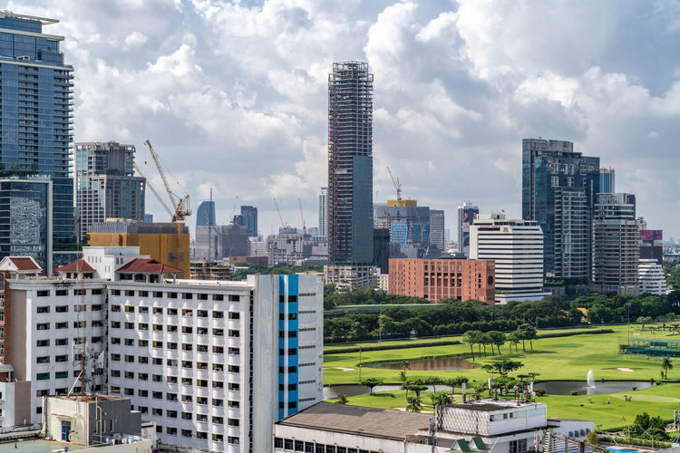 Bangkok, thailand - 12 august 2022 - view of bangkok cityscape high-rises and bts skytrains