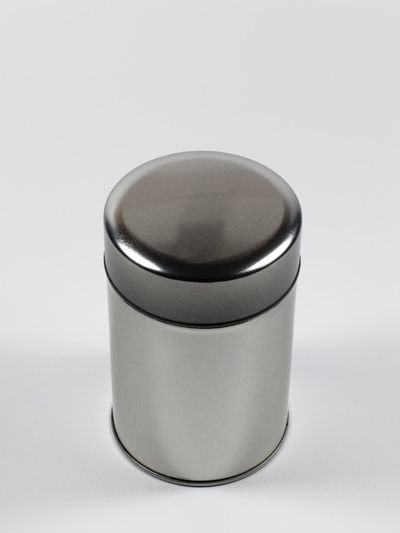 Close-up of tea cup on table against white background