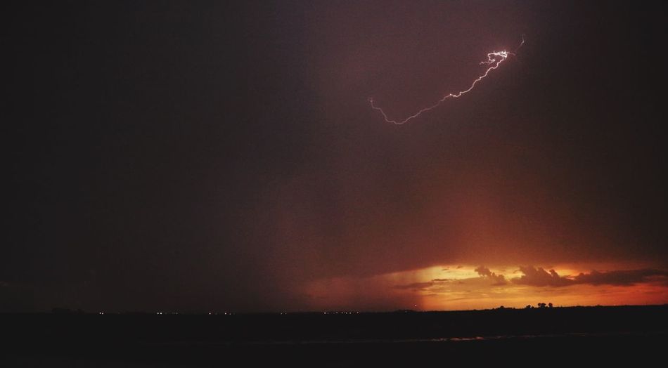 Lightning in sky during sunset