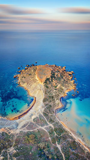 High angle view of sea shore against sky