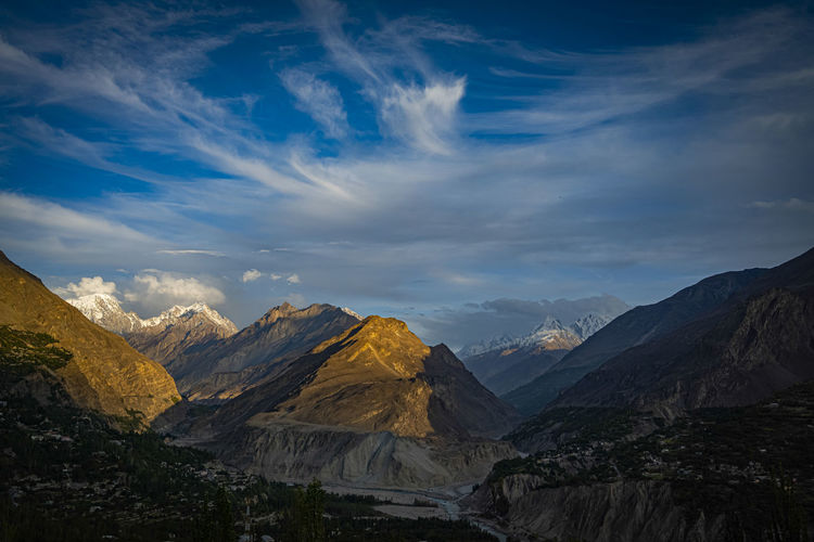 View of mountain range against cloudy sky