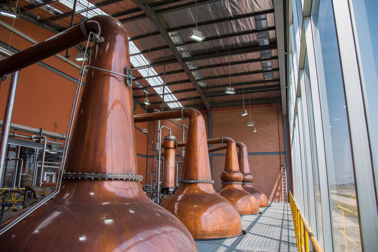 Copper pot stills in a whiskey distillery.