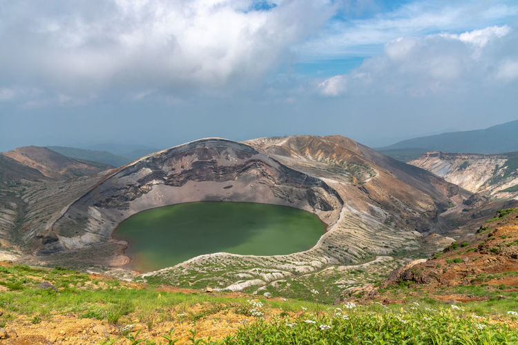 Okama crater lake at mount zao in summer sunny day. active volcano in miyagi prefecture, japan