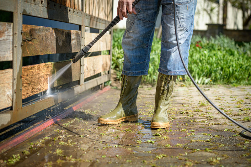 Low section of man working outdoors