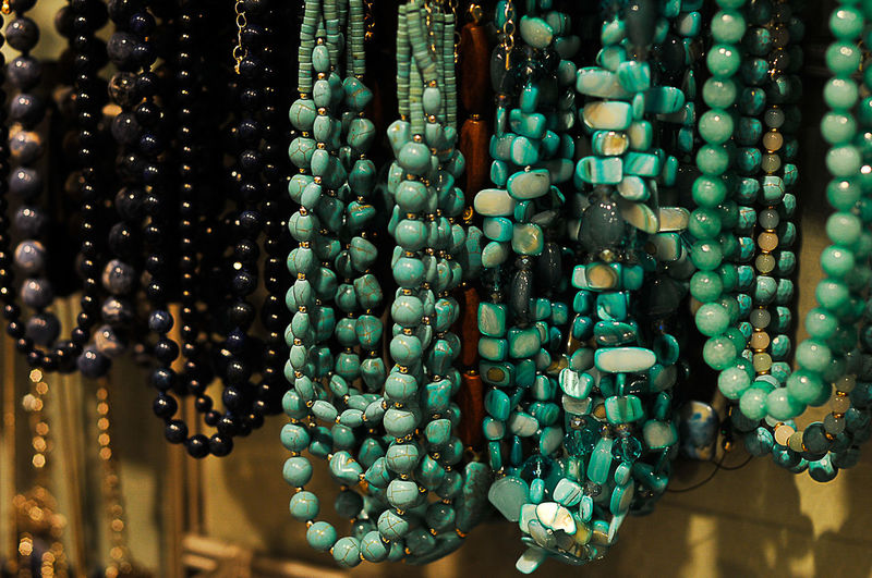 Close-up of necklaces hanging for sale in store