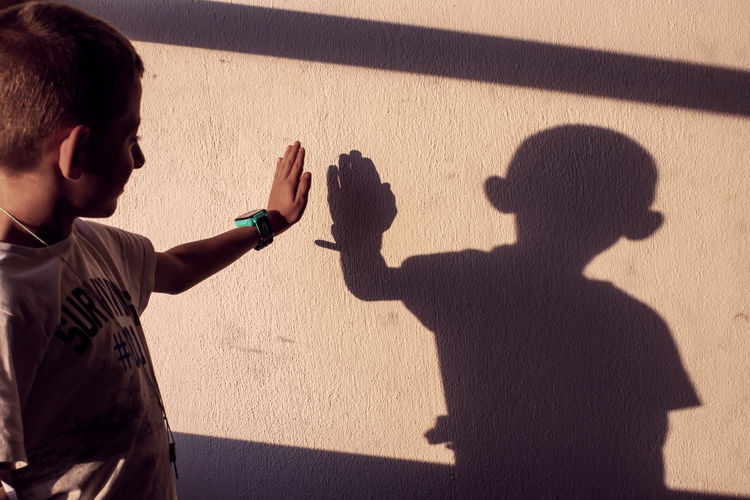 High angle view of people shadow on wall