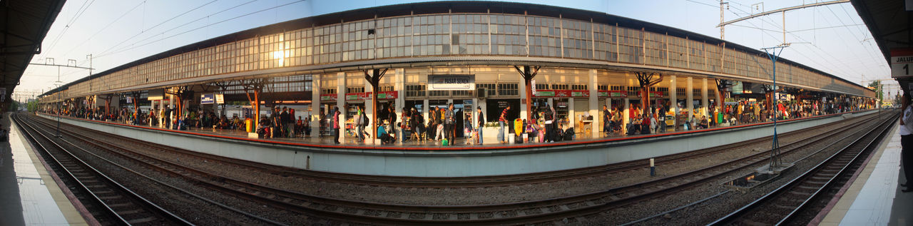 People waiting at railroad station platform