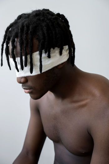 Black man wearing blindfold portrait