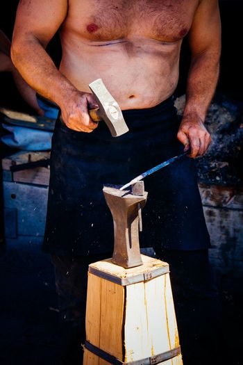 Iron worker with hammer and anvil