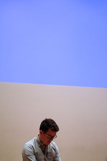 Man against colored background