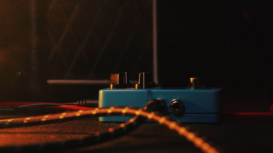 Close-up of audio equipment on floor