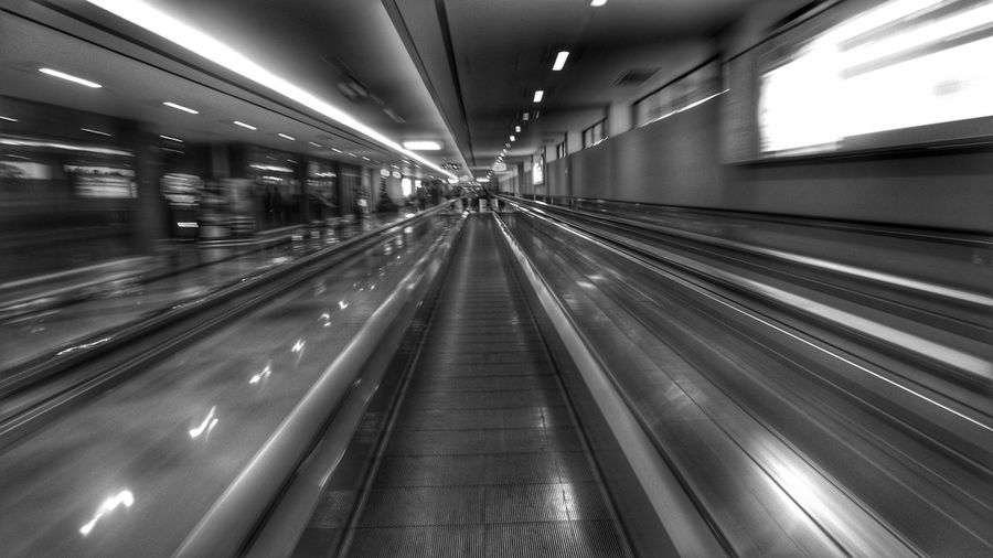 Blurred motion of moving walkway in airport