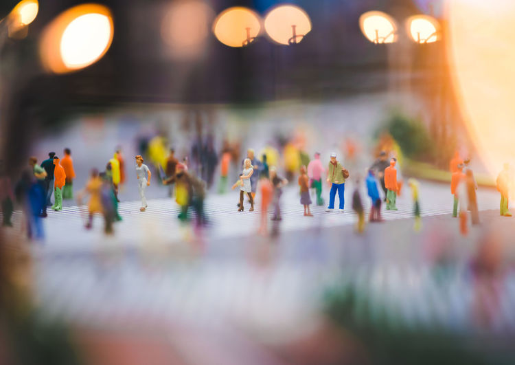 Close-up of group of people on table