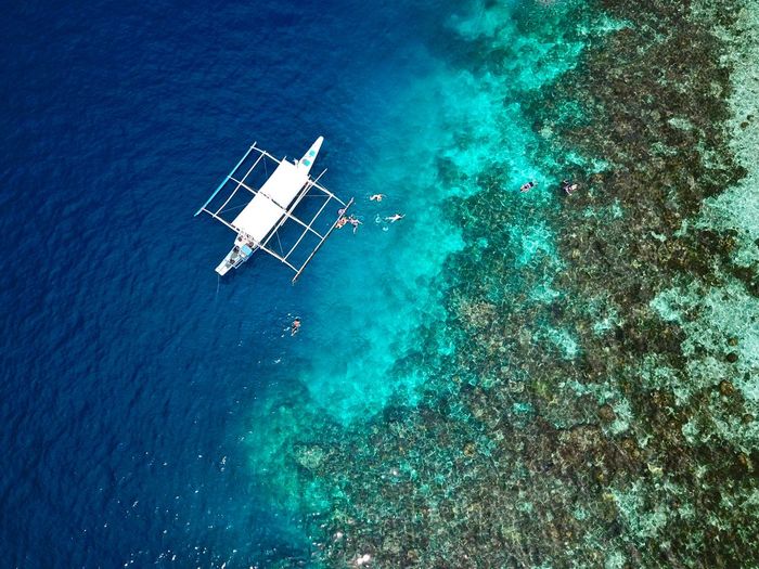 Aerial view of a tourist boat at the philippines islands of el nido in palawan