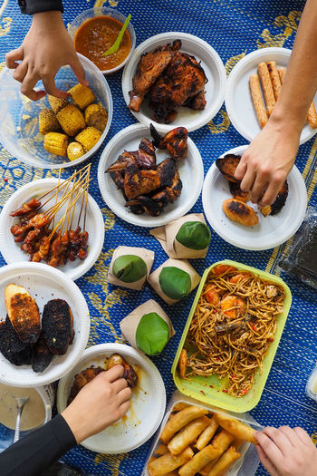High angle view of barbeque and potluck menu  food
