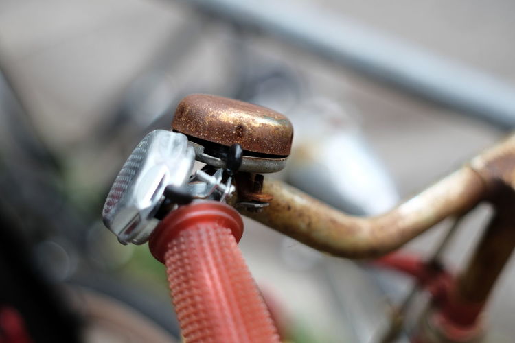 Close-up of bicycle parked on metal