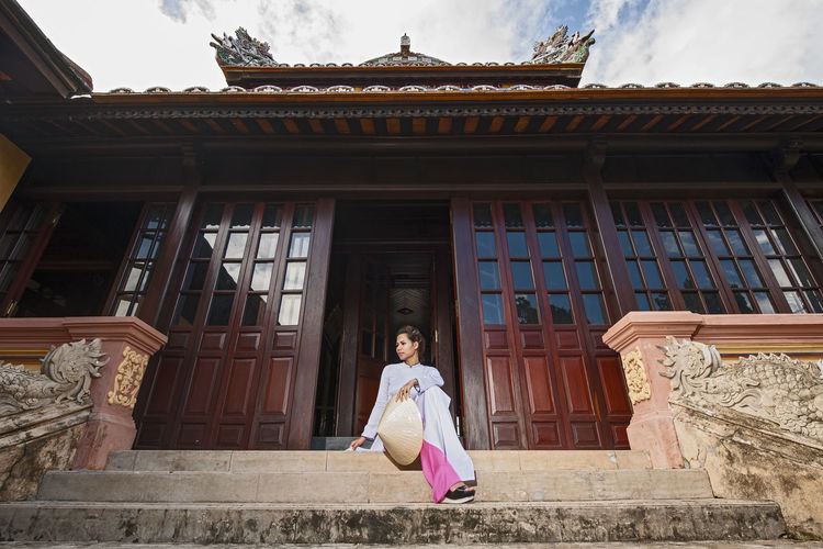 Beautiful woman exploring the imperial palace in hue / vietnam