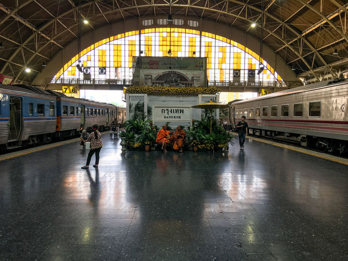 People in train at railroad station
