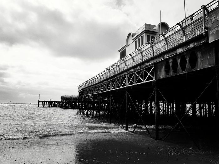Pier over sea against sky