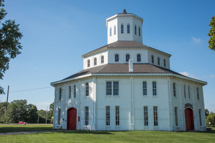 Low angle view of building against blue sky