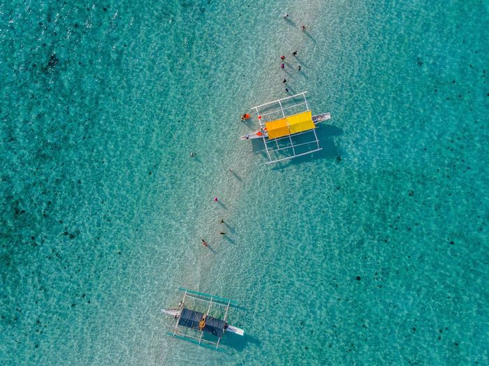 Aerial view of outrigger boats at sea
