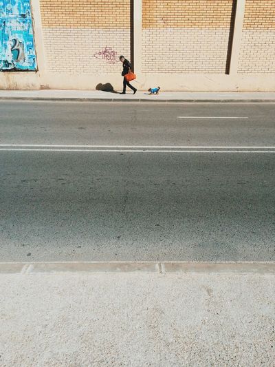 Man with dog on street
