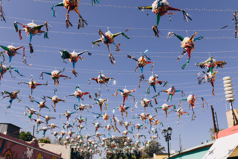 Piñatas hanging over a street for a celebration in oaxaca, mexico