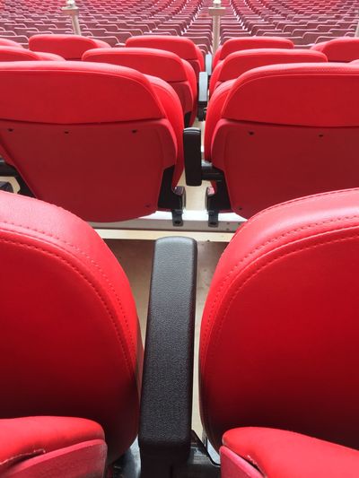 Close-up of empty seats in stadium