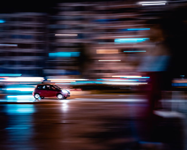 Blurred motion of car on road at night