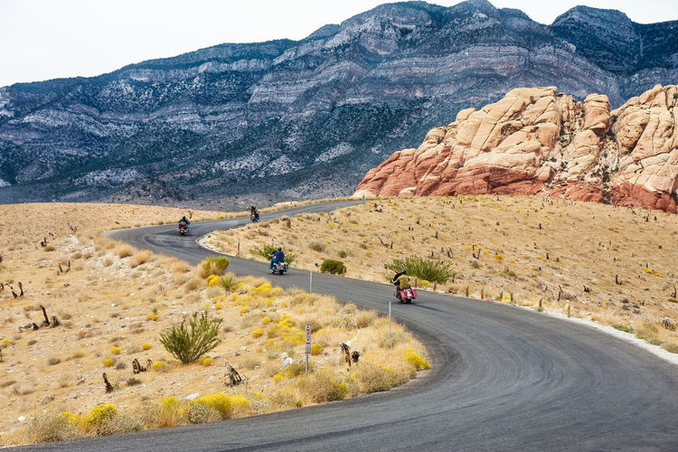 Scenic view of motorbikes on mountain road