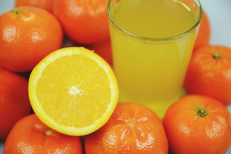 Close-up of oranges and juice